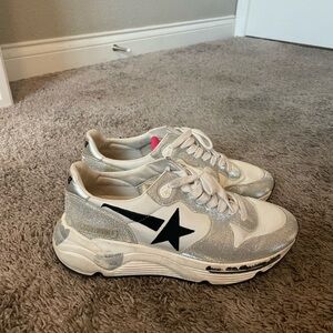 White and silver Golden Goose with black star